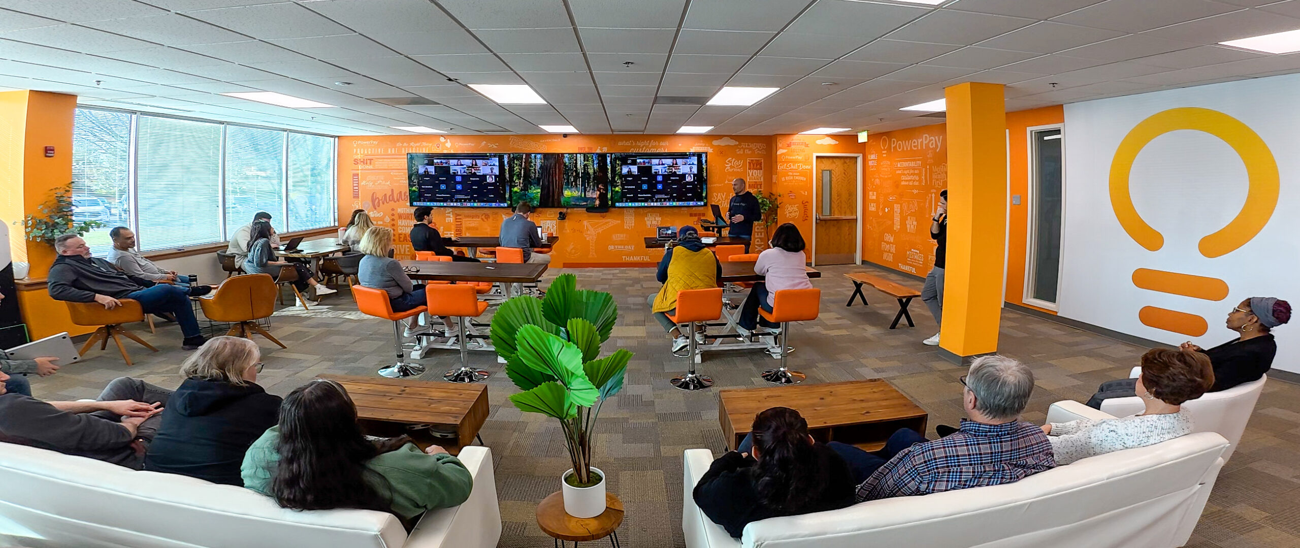 PowerPay founder Mike Petrakis presenting to employees during an internal company meeting