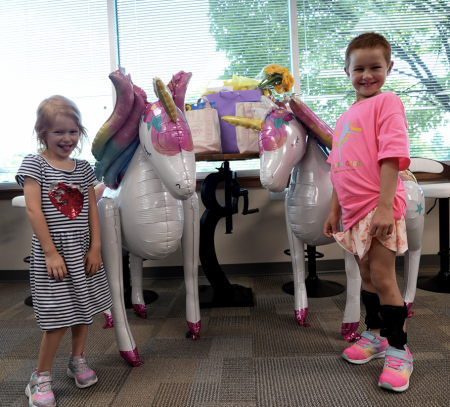 During Family Day, employees had the chance to welcome Emilia, her sister Lynnea, and their dad to the office for games, letters, prizes, and time together.